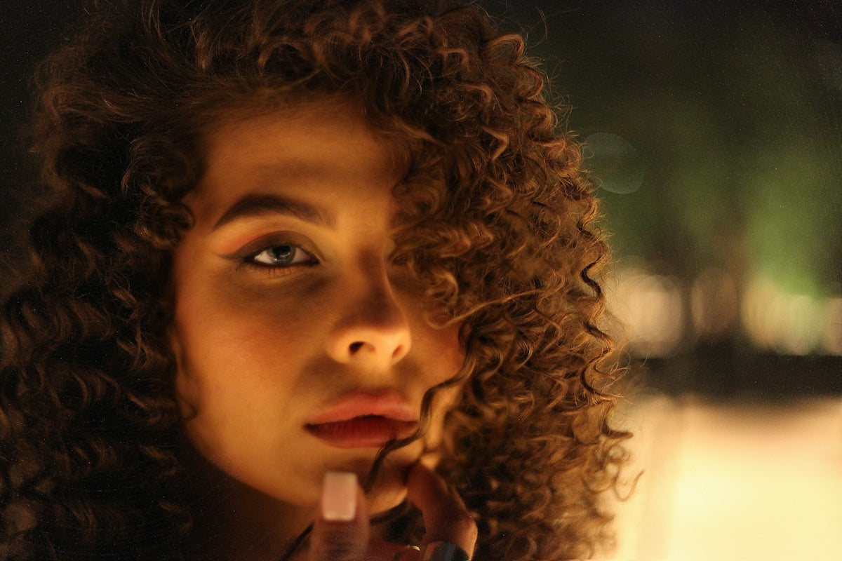 a woman with curly hair Image